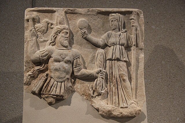 Roman relief showing Jupiter and Juno enthroned, with symbols of state and law