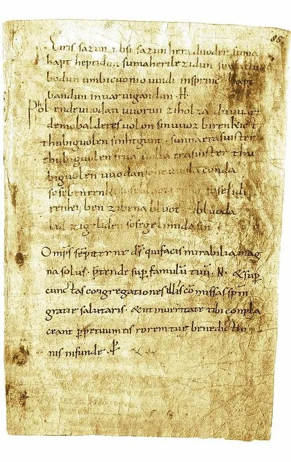 Manuscript leaf in Old High German: the Merseburg Charms set in neat lines with a large capital at the start.