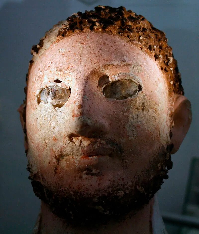 Close view of a mummy mask made of painted cartonnage in the Papyrus Museum, Vienna.