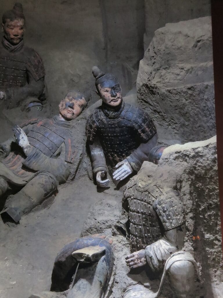 Detail of terracotta warriors with preserved paint on armor and garments.