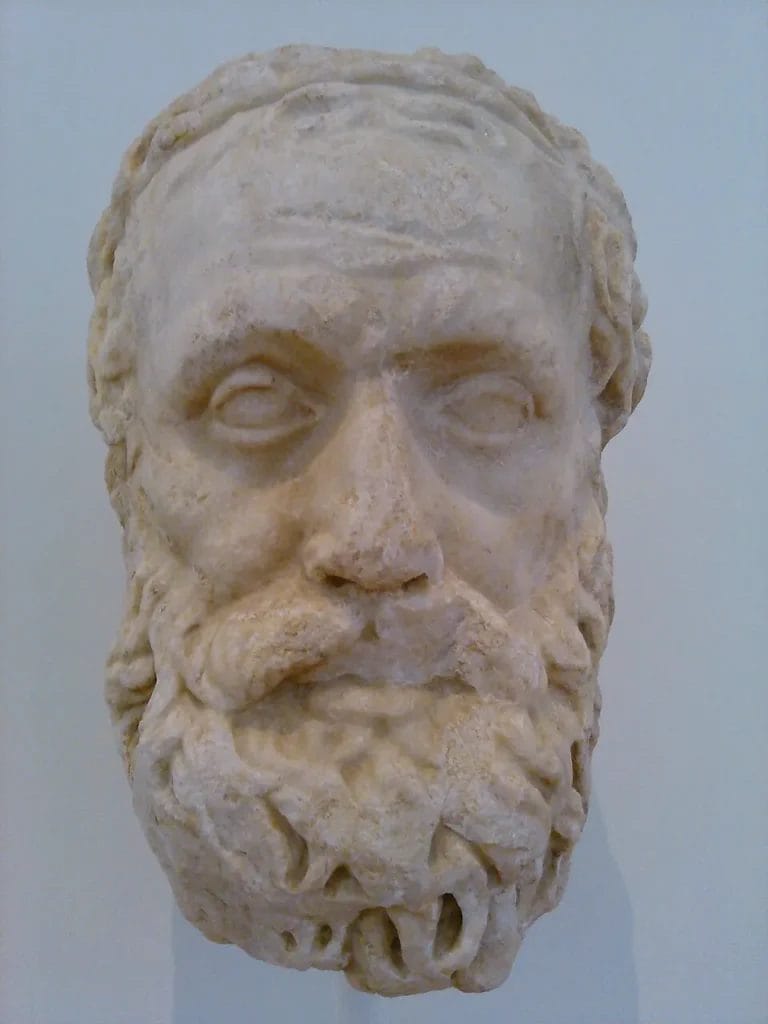 Marble portrait bust of Aeschylus on a plinth in a museum gallery.