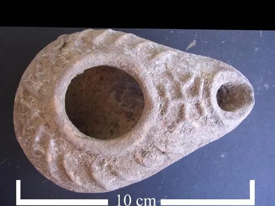 Ceramic Byzantine oil lamp from Samaria with cross mark near the nozzle