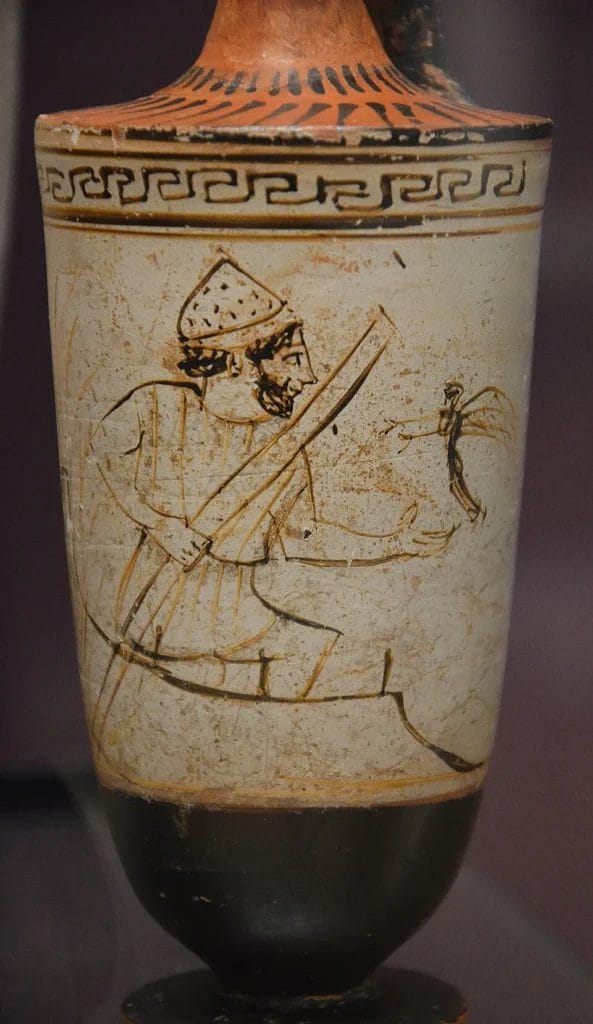 Ferryman Charon with pole beside reeds, receiving a youth’s shade on an Attic lekythos.