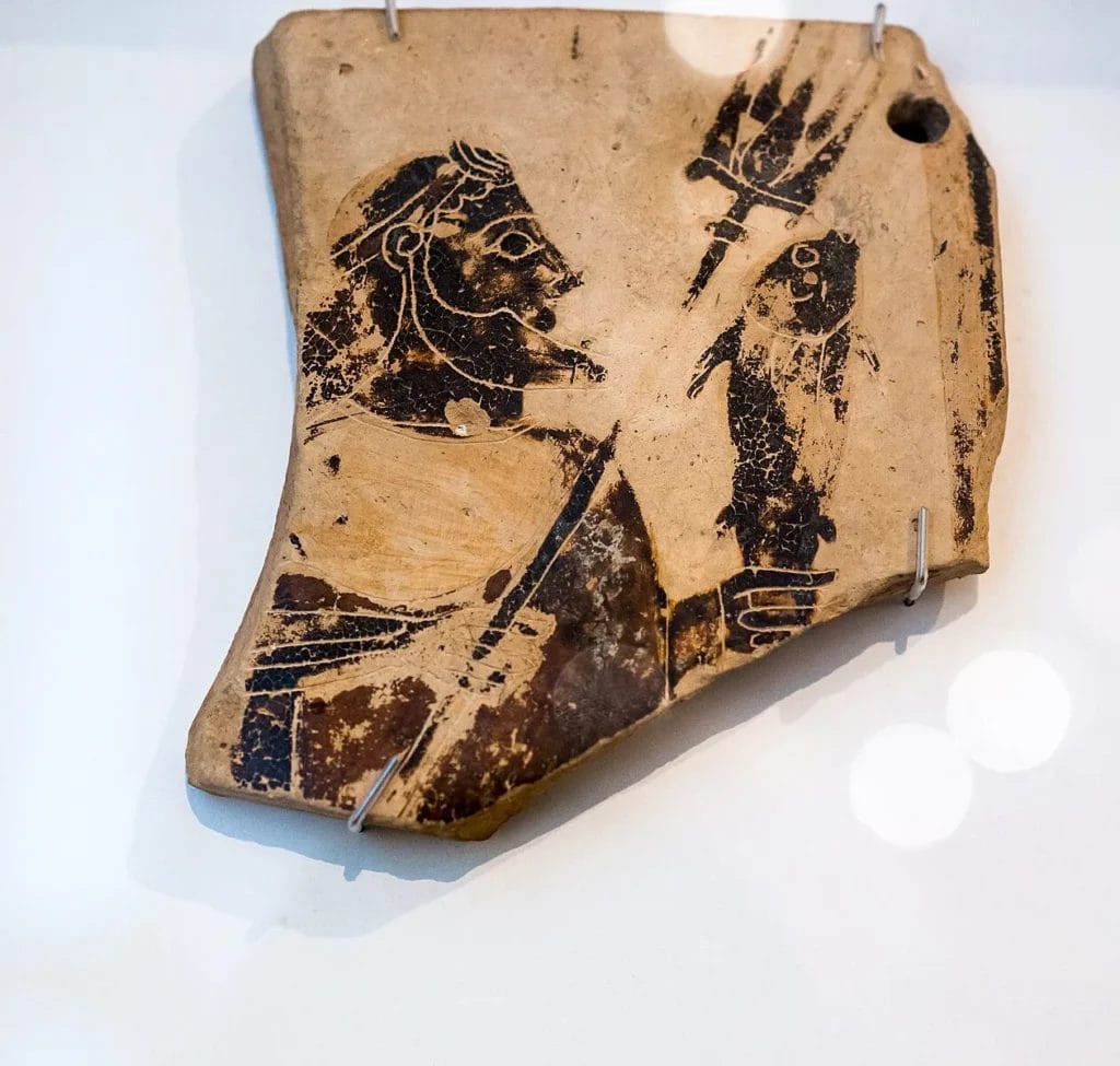 Painted plaque with Poseidon holding trident and dolphin