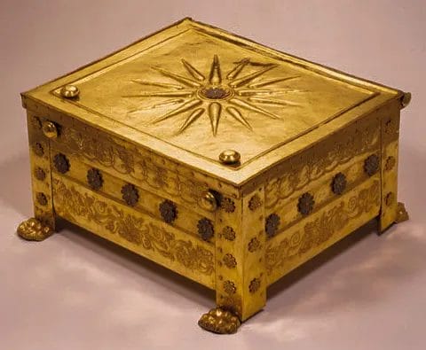 Close-up view of the golden larnax with starburst emblem in Vergina