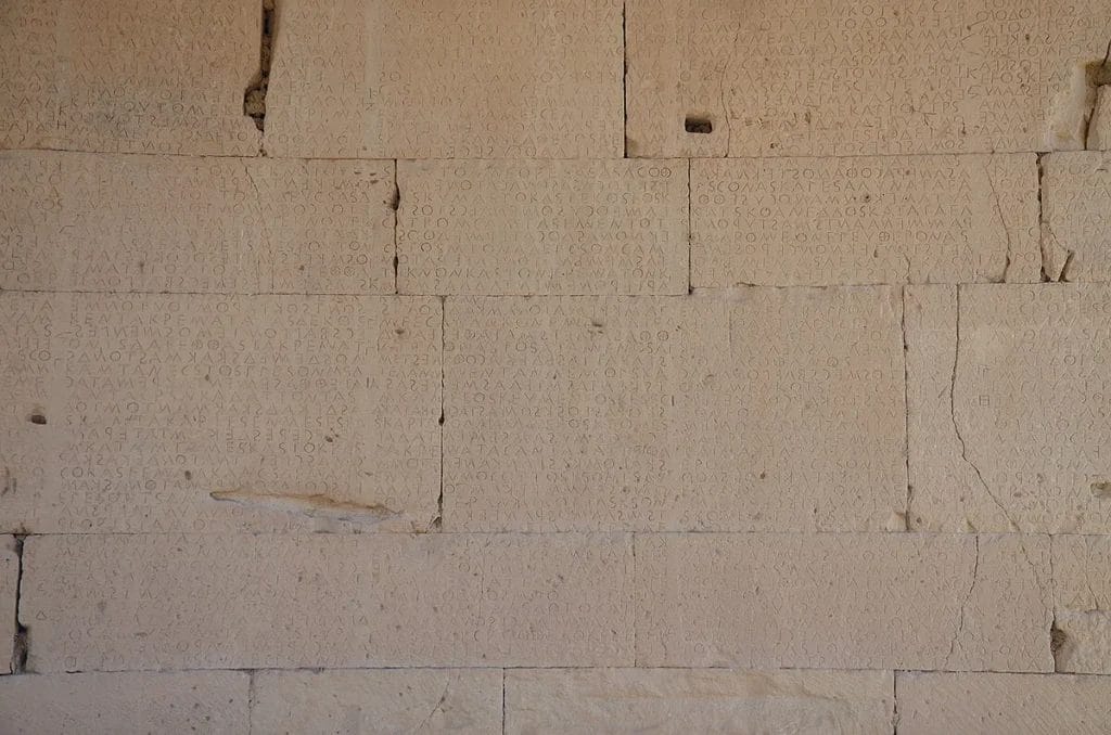 Close view of boustrophedon Greek text carved in limestone blocks at Gortyn.
