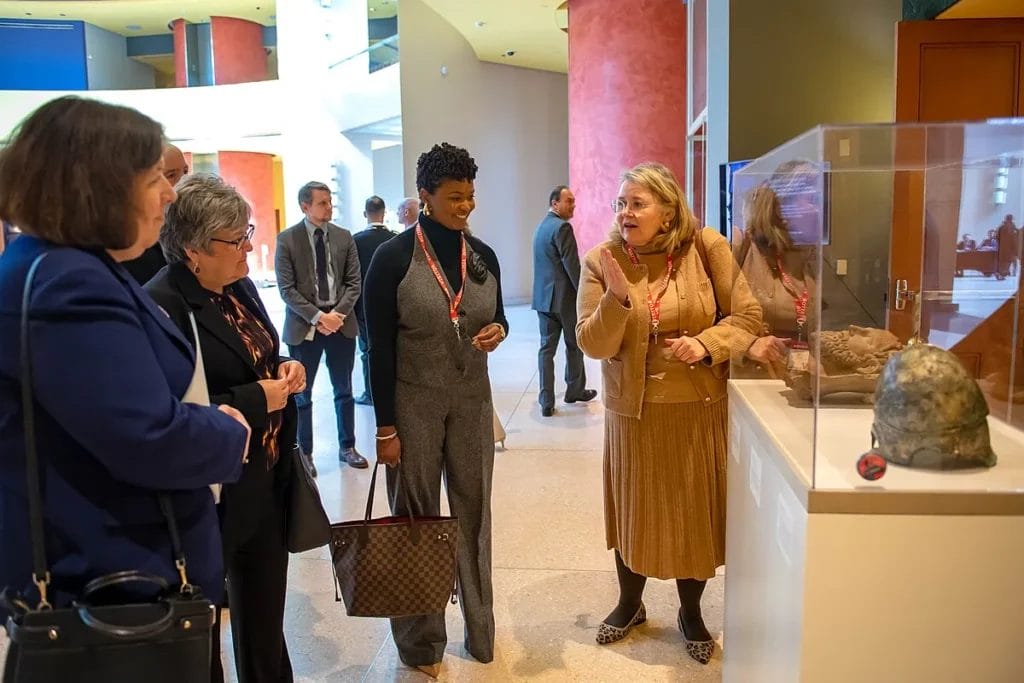 Table display of antiquities during a Homeland Security Investigations repatriation event at the Italian Embassy.