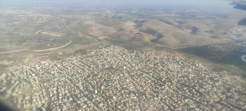 Aerial photograph of Kafr Qasim showing urban edge and open ground where salvage excavations often occur