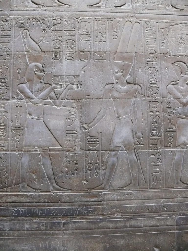 Wall relief showing pharaonic procession scene at Luxor Temple