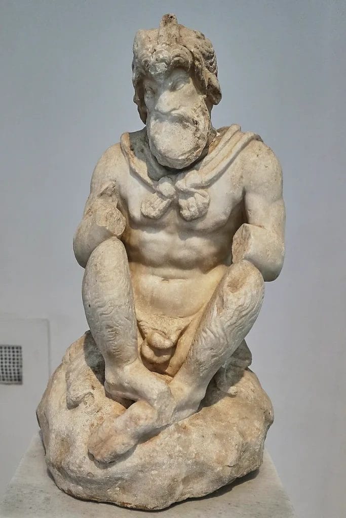 Seated marble Pan statuette that once held syrinx