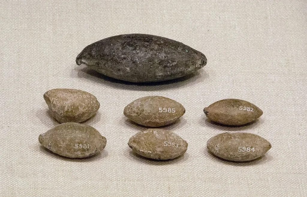 Close view of a biconical lead sling bullet from Cyprus in the Met collection, CC0 image