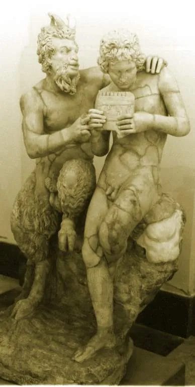 Marble statue of Pan instructing Daphnis on panpipes
