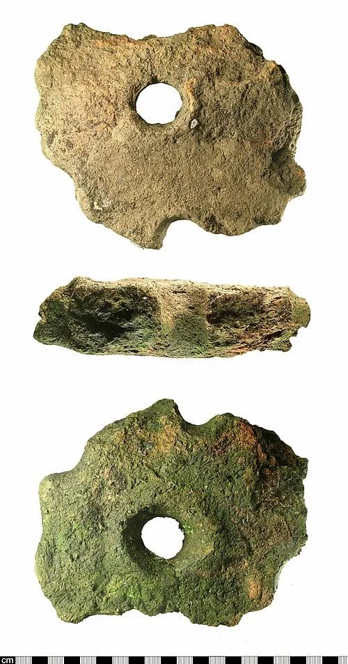 Perforated ceramic slab fragment from a kiln floor