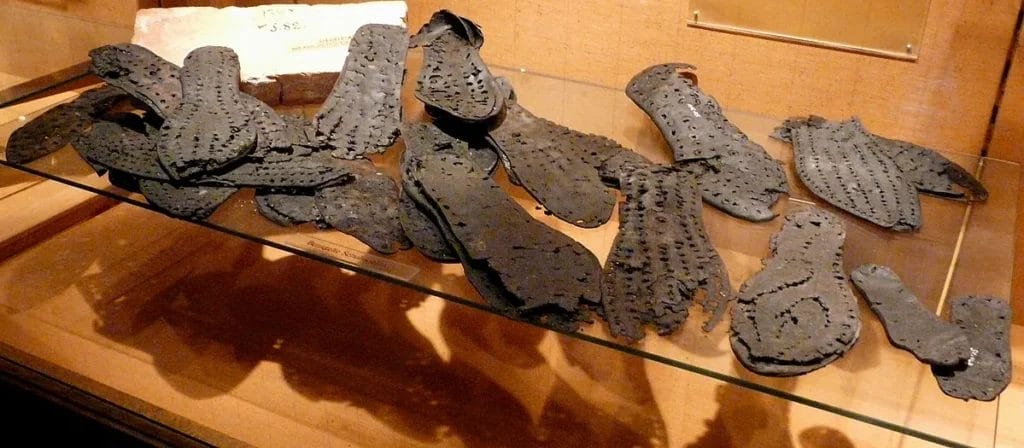 museum case view of caligae soles with dense hobnails