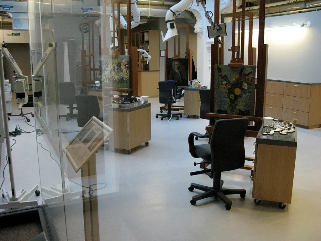Conservation lab space with benches and equipment behind glass at the Smithsonian’s Lunder Conservation Center