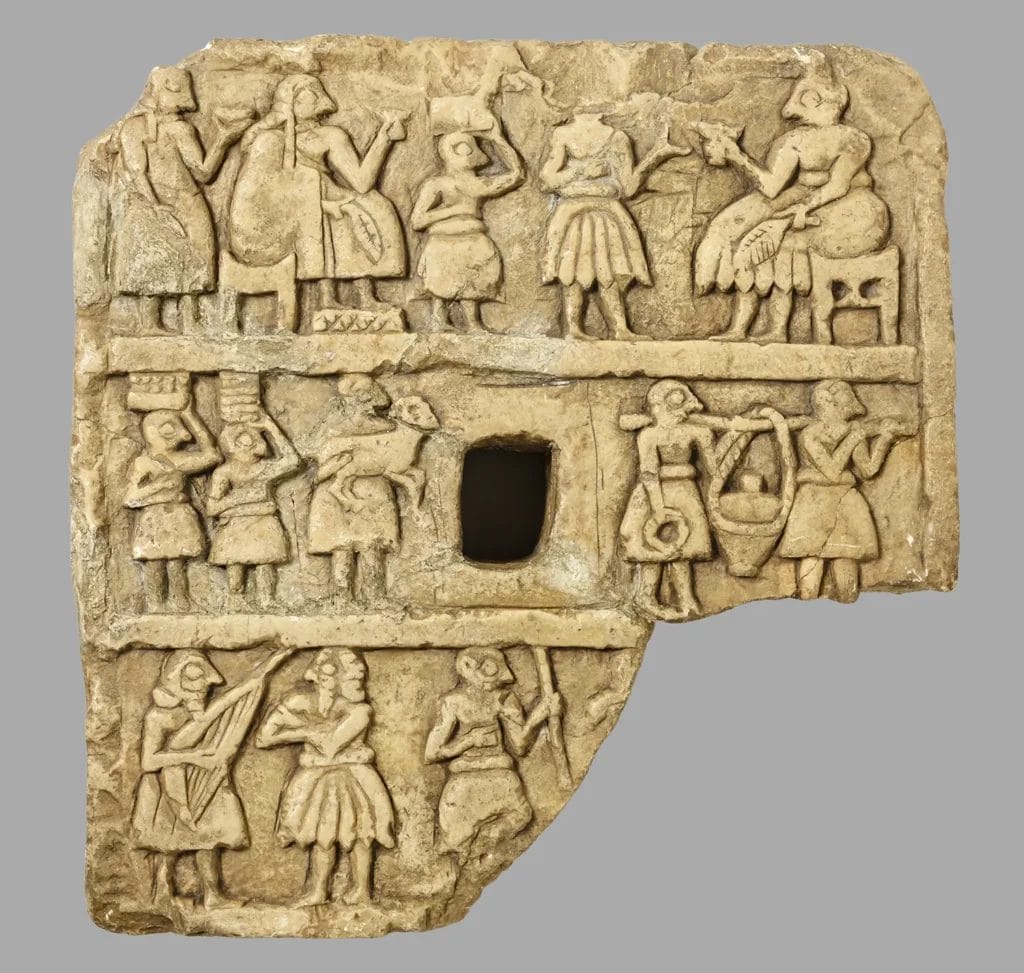 Assyrian limestone relief showing musicians in courtly procession, illustrating coordinated ceremony and royal image-making