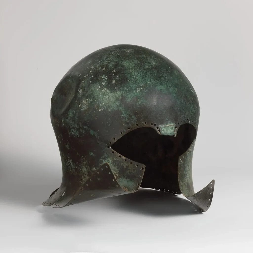 Bronze Corinthian helmet from ancient Greece showing the characteristic cheek plates and nose guard that protected Greek hoplites in battle, Metropolitan Museum of Art.