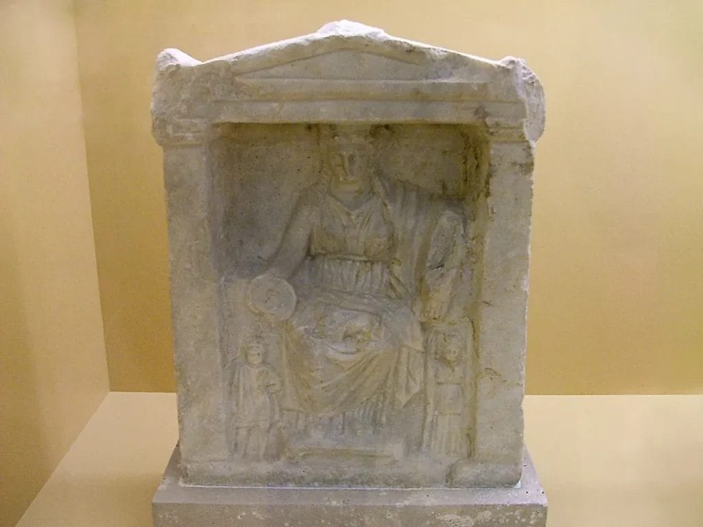 Roman stone relief depicting Cybele seated with lions and worshippers