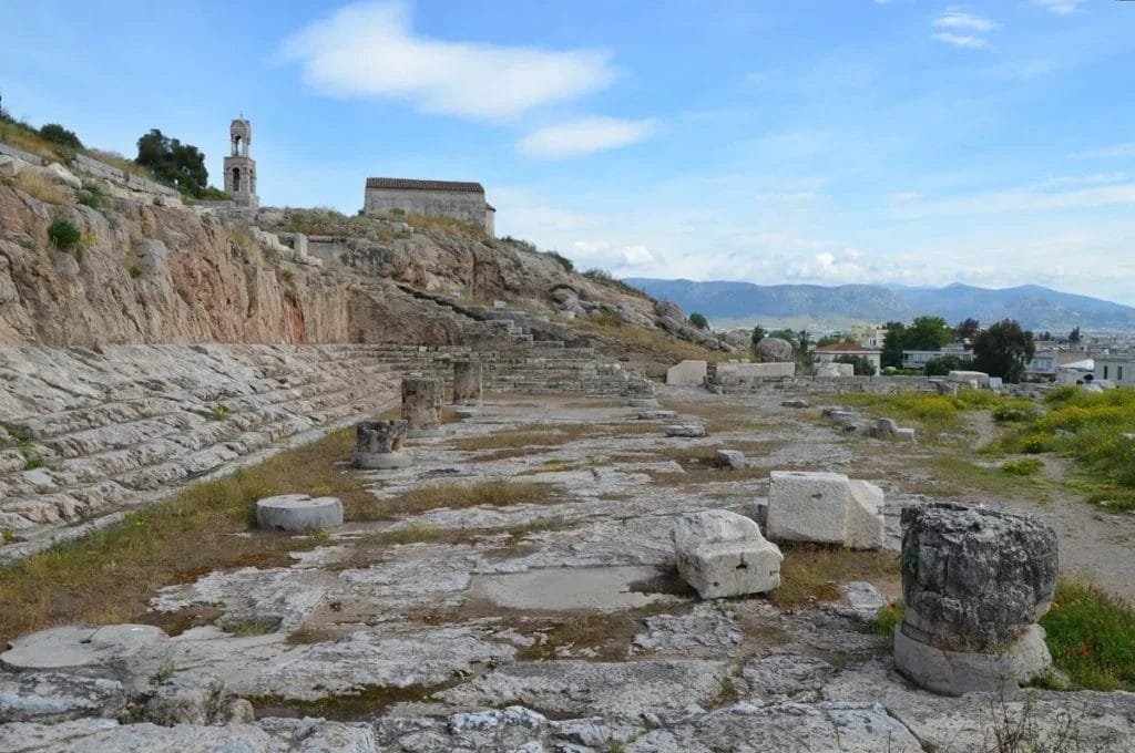 Ancient stone foundations and columns at Greek temple site worshipping Persephone