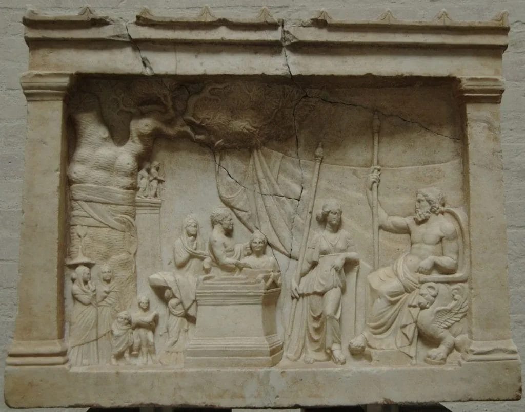 Marble relief showing a family conducting a small-scale sacrifice at a domestic altar with simplified ritual procedures and a smaller animal victim