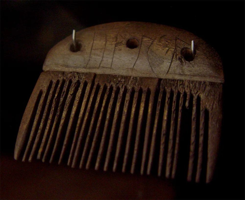 Antler comb from Vimose Denmark bearing one of the earliest runic inscriptions marking ownership or craftsperson identity from 160 CE.