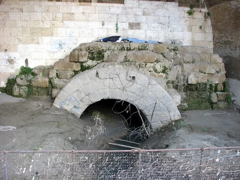 Cloaca Maxima mouth Tiber River Rome ancient stone archway modern view