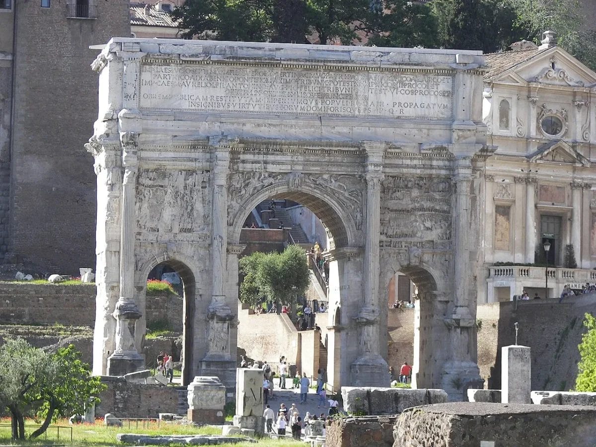 Arch of Septimius Severus with three arches and detailed relief panels depicting military victories