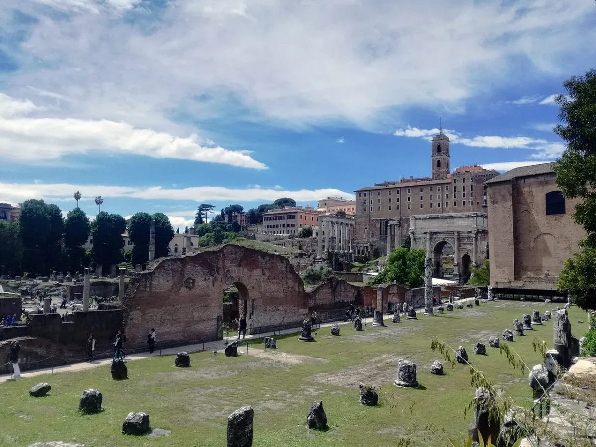 Basilica Aemilia ruins showing column bases and floor fragments along Via Sacra
