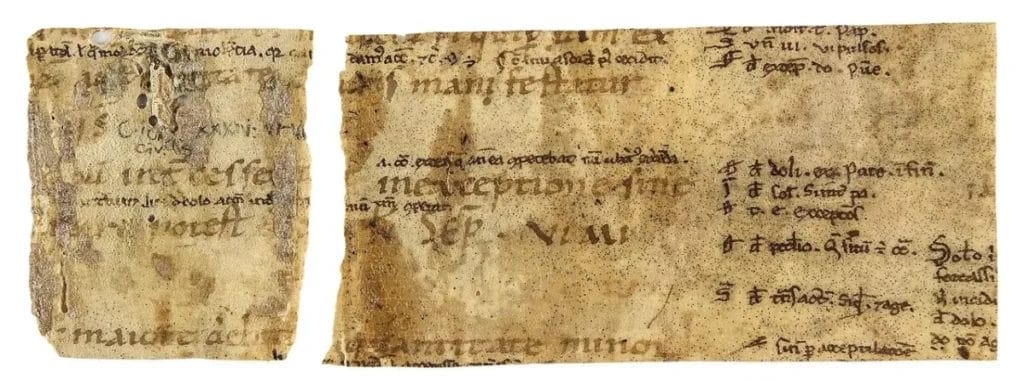 Two manuscript fragments reused around a binding spine, showing narrow columns of Latin text