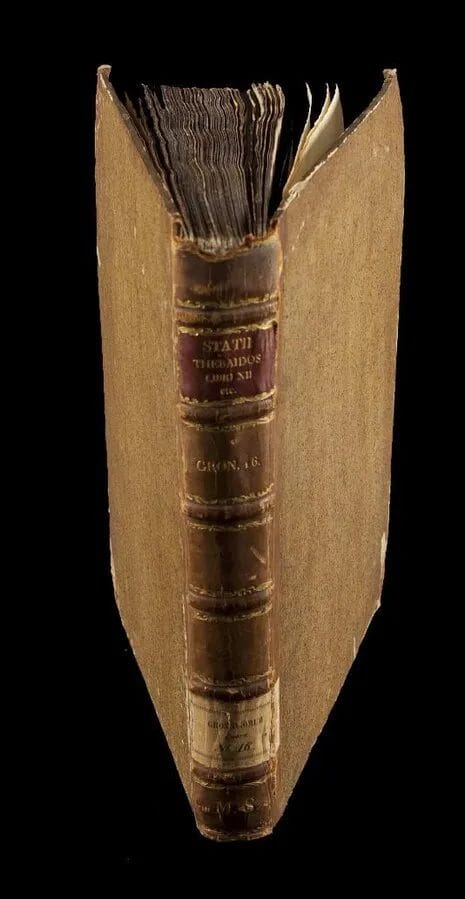 Scanned pages of Statius’s Thebaid with Latin text and headings