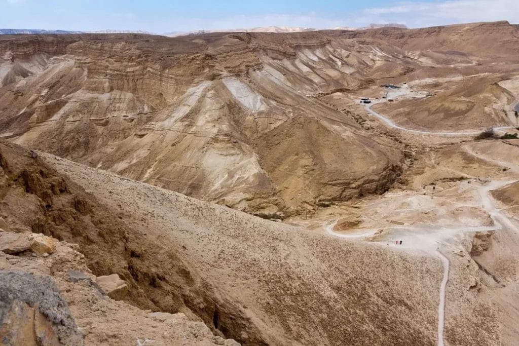 Earthen ramp rising to meet Masada's defensive walls
