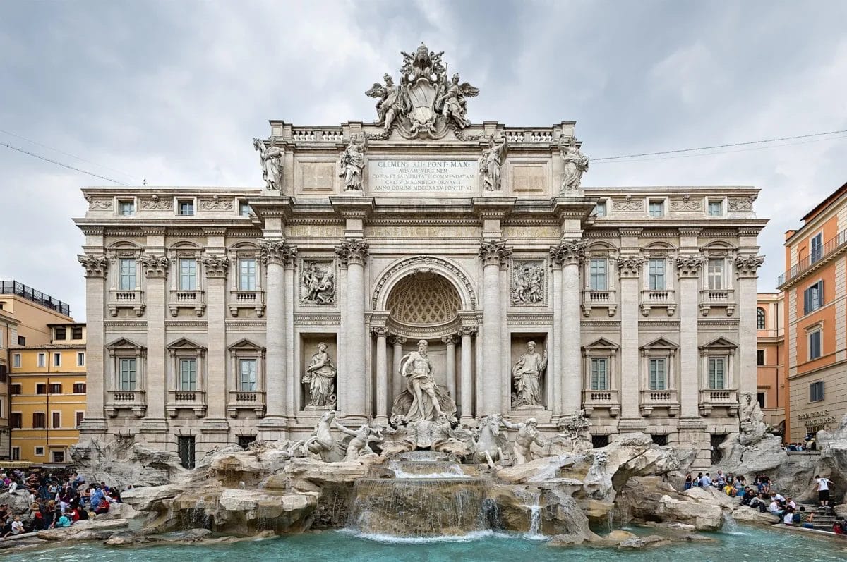 The Trevi Fountain in Rome with the central figure of Oceanus in his shell chariot against the Palazzo Poli, sights to see in Rome
