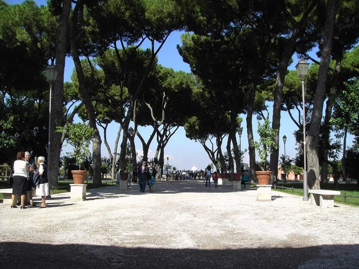 The terrace of the Giardino degli Aranci on the Aventine Hill in Rome with a view toward the dome of St. Peter's Basilica, sights to see in Rome
