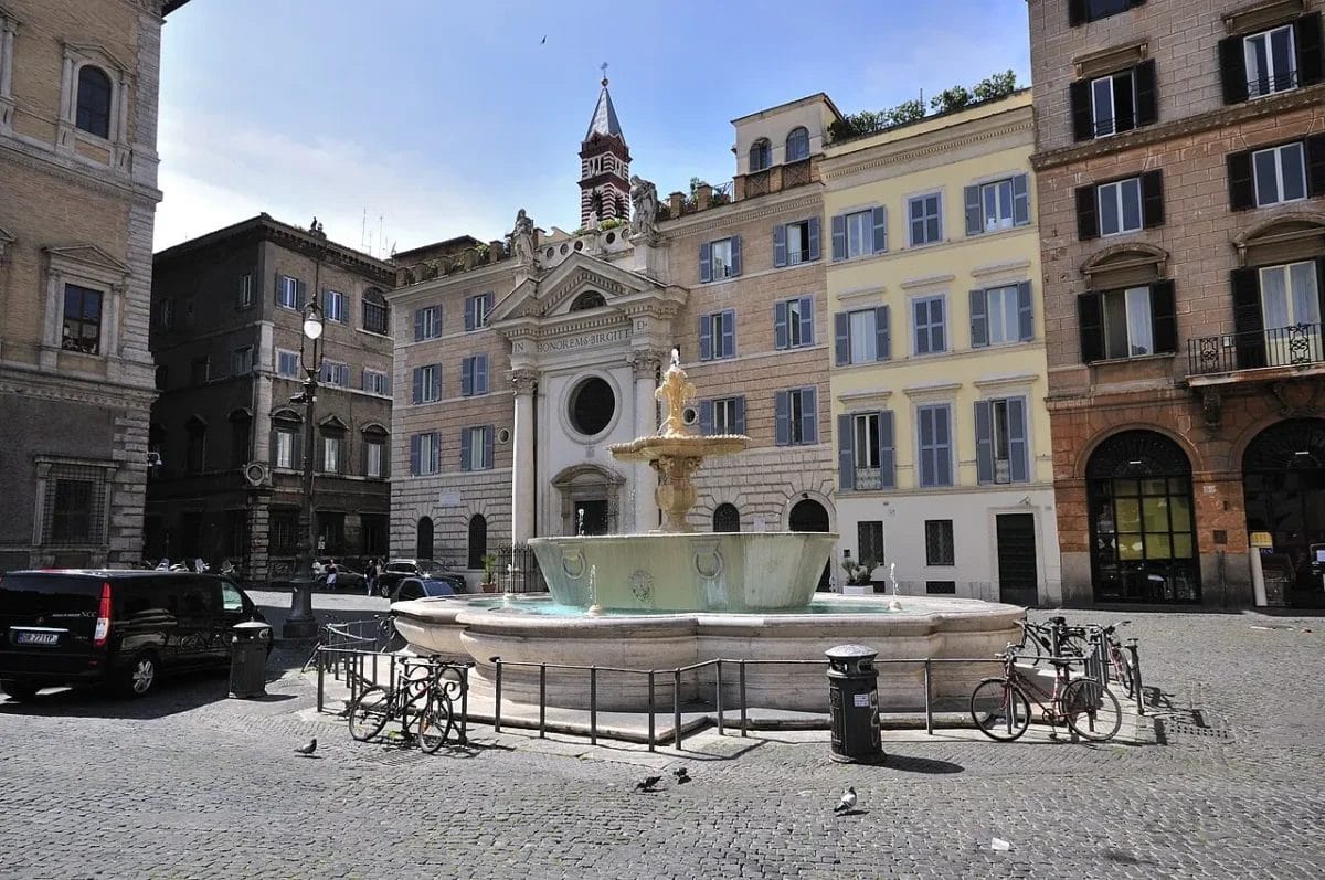 Piazza Farnese in Rome with the Palazzo Farnese facade and Roman bathtub fountain basins in the foreground, sights to see in Rome