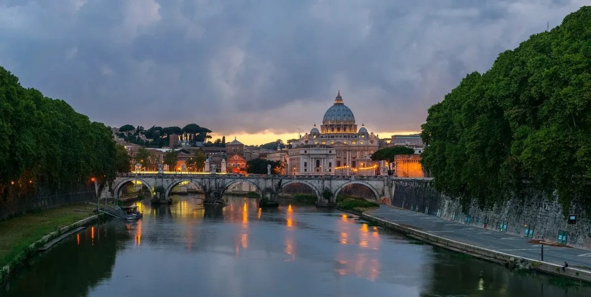 Ponte Sant'Angelo bridge in Rome with Bernini's ten angel statues lining the parapet and Castel Sant'Angelo behind, sights to see in Rome
