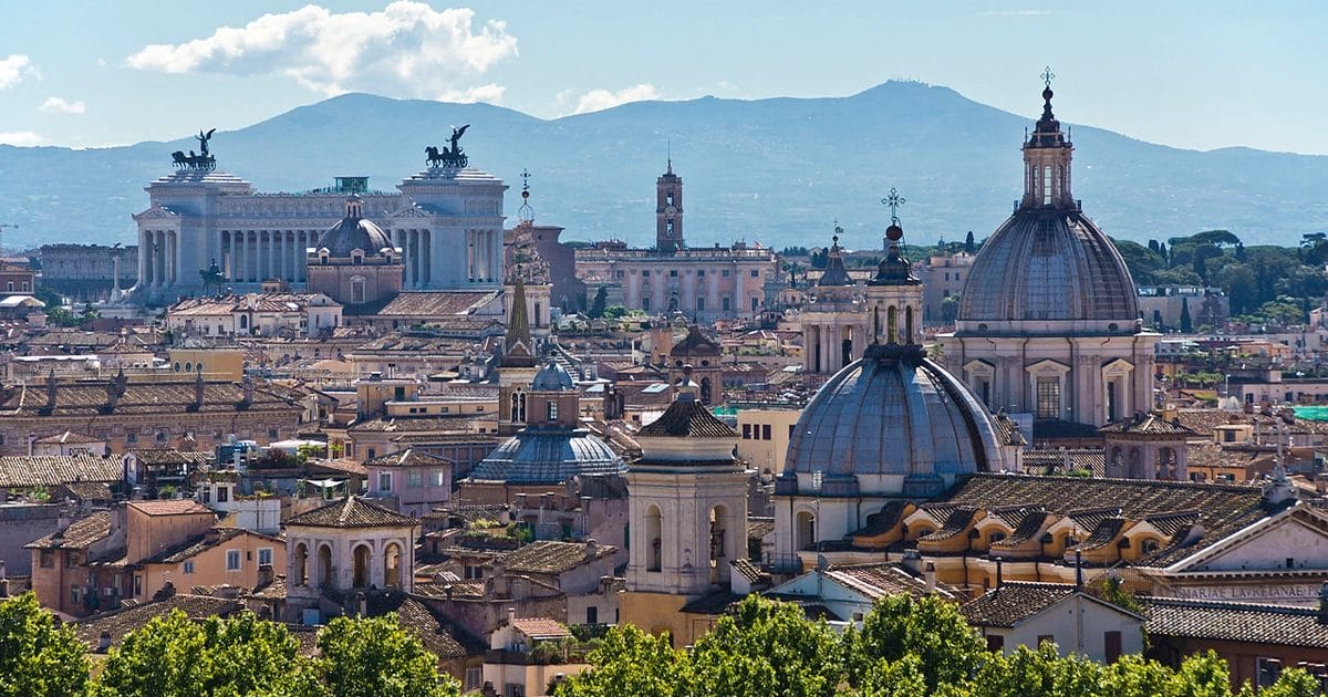 Aerial view of Rome's historic center showing the Colosseum, Forum, and city skyline, sights to see in Rome