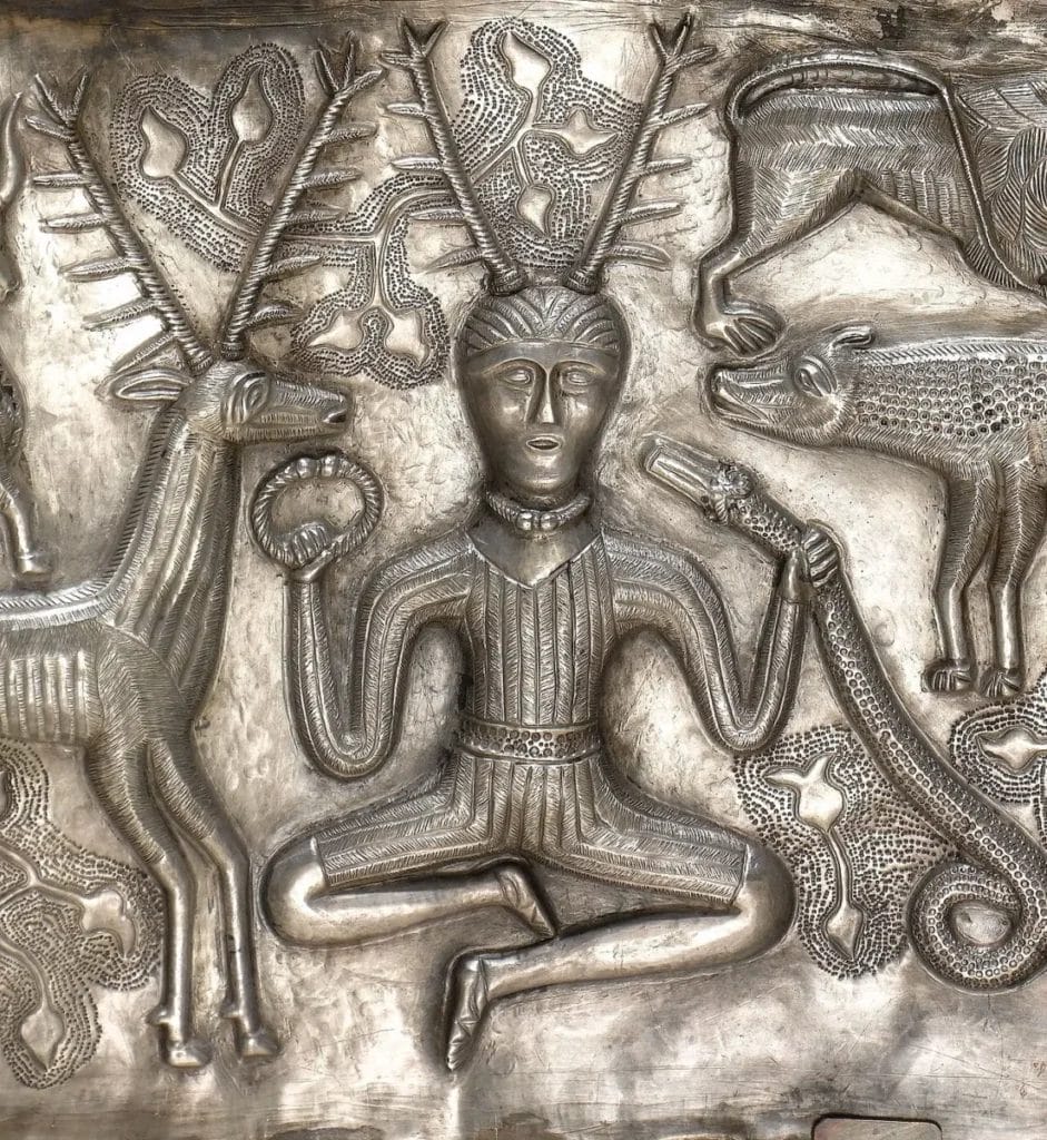 Antlered seated figure holding a torc and horned serpent on the inner silver plate of the Iron Age Gundestrup Cauldron, National Museum of Denmark
