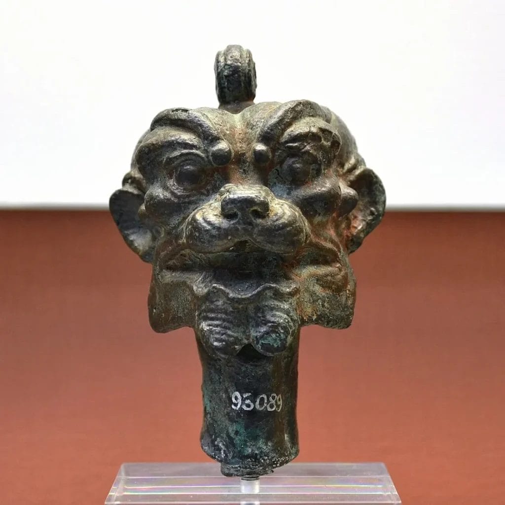 Bronze Pazuzu head with suspension ring, used as protection against Lamashtu for mothers and newborn babies