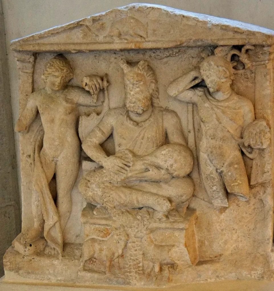 Antlered Gallo-Roman figure flanked by Apollo and Mercury on the Reims altar relief, with torc and animals below, Musée Saint-Remi